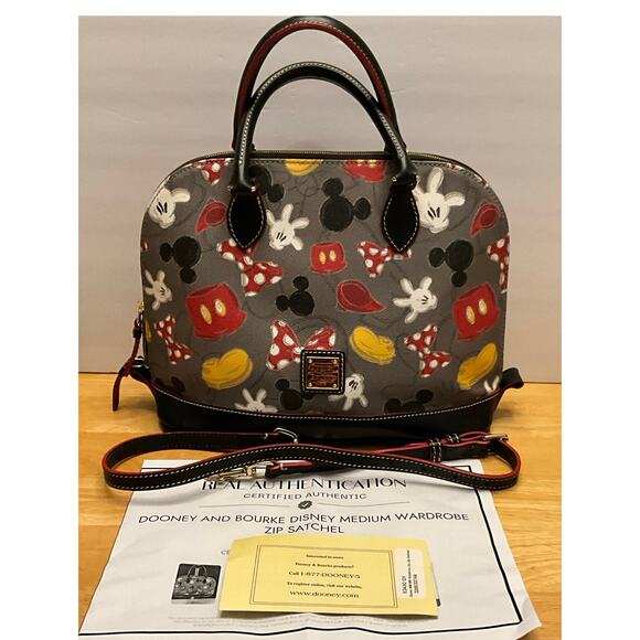 Dooney & Bourke Handbags - EUC Disney Dooney & Bourke Medium Wardrobe Zip Satchel / COA / Registration Card